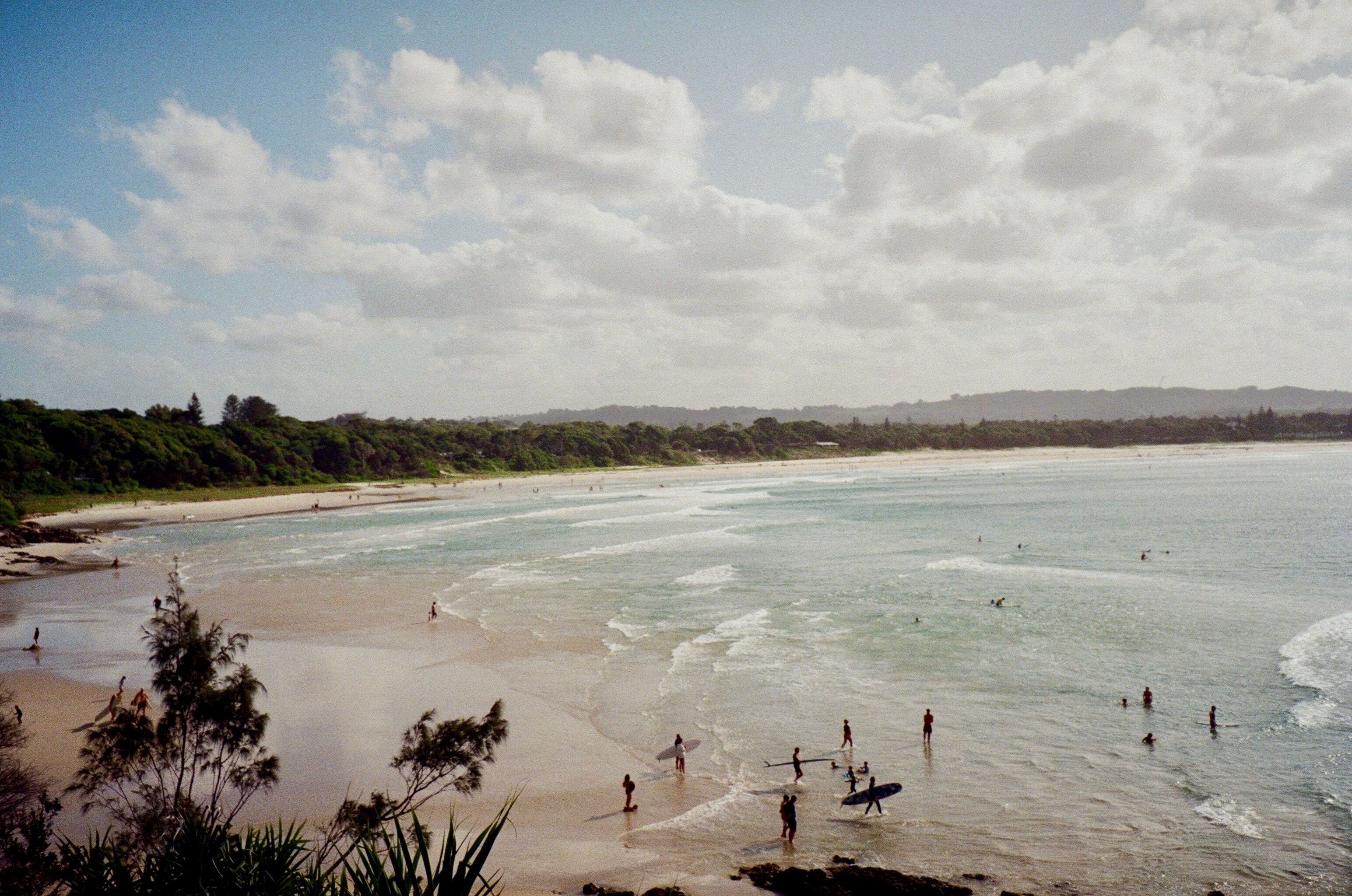 A traveler looking out over a coastal town with the Trovey app